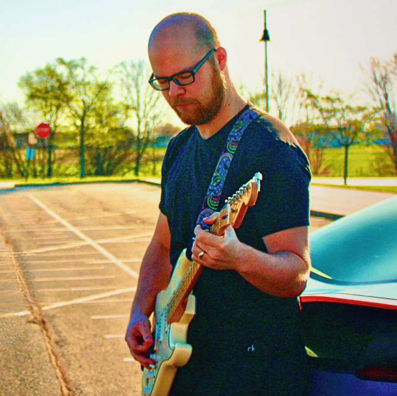 Matt Day - Headshot with Guitar